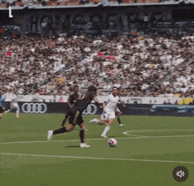 Soccer Players On A Field With An Audi Ad GIF
