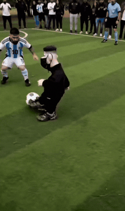 Soccer Players On A Field With One Wearing A Blue Shirt GIF