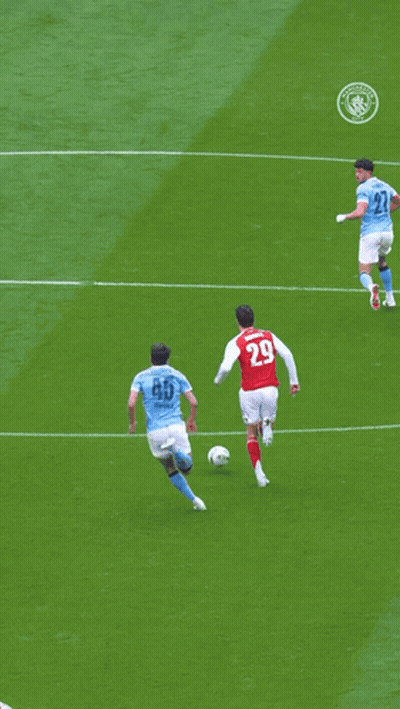 Soccer Players On A Field With One Wearing The Number 33 GIF