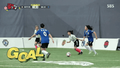 Soccer Players On A Field With The Word Goal On The Ground GIF