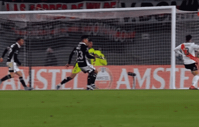 Soccer Players On Field In Front Of Amstel Sign GIF