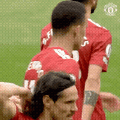 Soccer Players On Field One Pointing At Camera GIF