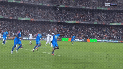Soccer Players On Field With Abidian Ad GIF