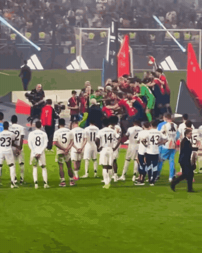Soccer Players On Field With Blue Sign Kinza GIF
