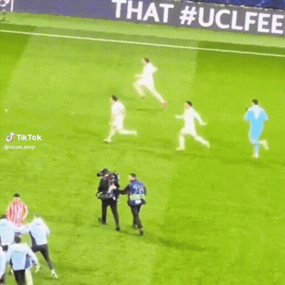 Soccer Players On Field With Champions League Banner GIF