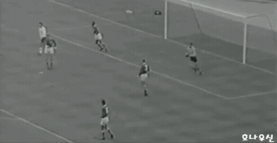 Soccer Players On Field With Chinese Writing GIF
