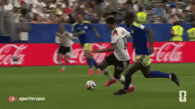 Soccer Players On Field With Coca Cola Advertisements GIF