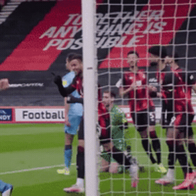 Soccer Players On Field With Football Sign GIF