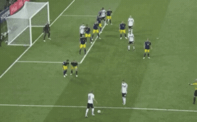 Soccer Players On Field With Goalie GIF