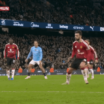 Soccer Players On Field With Midea Betway Ads GIF