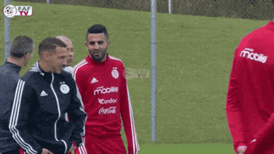 Soccer Players On Field With Mobile Shirt GIF