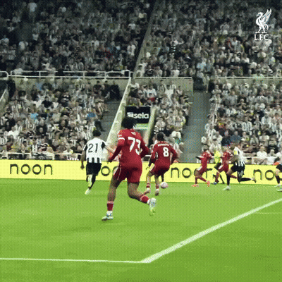 Soccer Players On Field With Noon Sign GIF