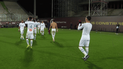 Soccer Players On Field With Number 4 Jersey GIF