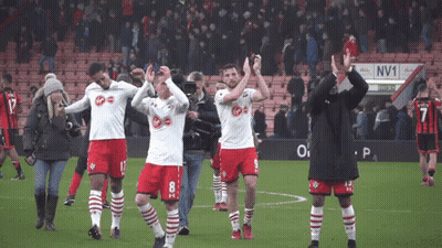 Soccer Players On Field With NV1 Sign GIF