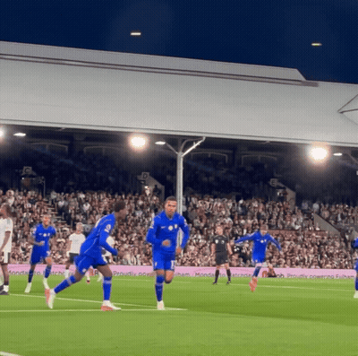 Soccer Players On Field With Proudly Banner GIF