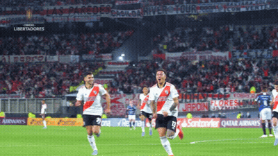 Soccer Players On Field With Qatar Airlines Ad GIF