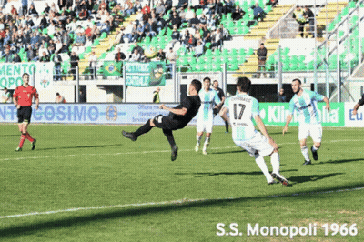 Soccer Players On Field With S.S. Monopoli 1966 Banner GIF