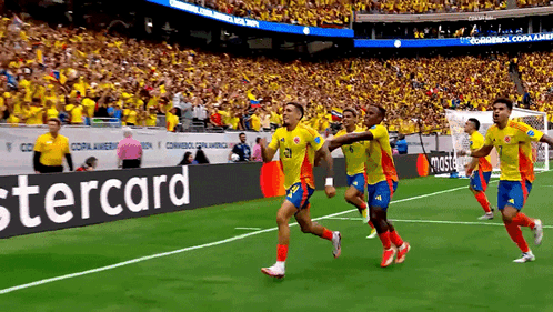 Soccer Players On Field With Stercard Banner GIF