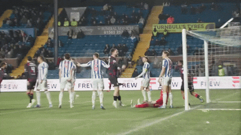 Soccer Players On Field With Turnbulls Tyres Sign GIF