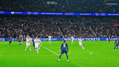 Soccer Players On Field With UEFA Champions League Banners GIF