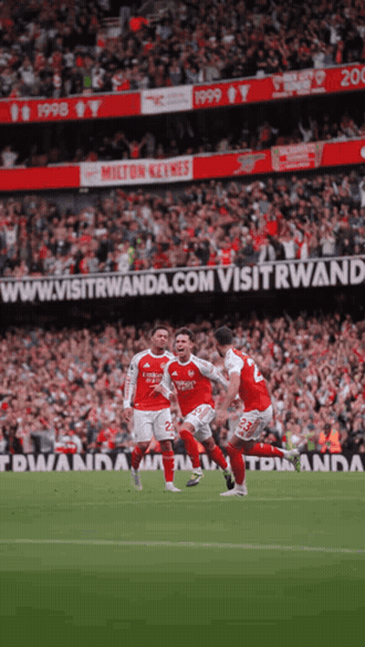 Soccer Players On Field With Visitwanda.com Banner GIF