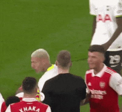 Soccer Players On Field With Xhaka Shirt GIF