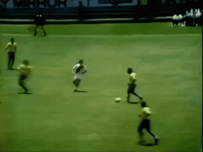 Soccer Players On Field With Yellow PS Sign GIF