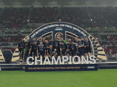 Soccer Players on Podium Saying Champions