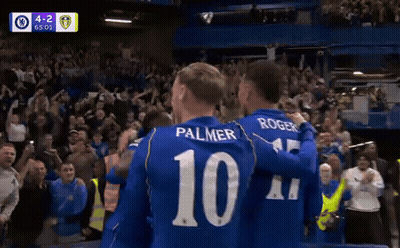 Soccer Players Palmer And Rogers Hugging In Front Of Crowd GIF
