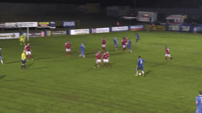 Soccer Players Playing Near Rip Timmy's Sign GIF