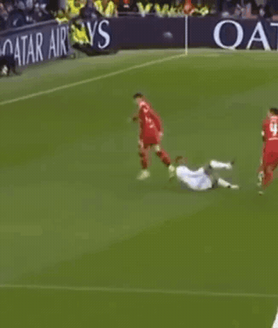 Soccer Players Playing On Field With Qatar Airlines Banner GIF
