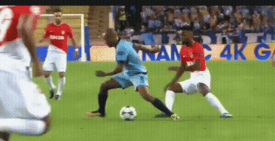 Soccer Players Playing On Field With Sign Saying 4K G GIF