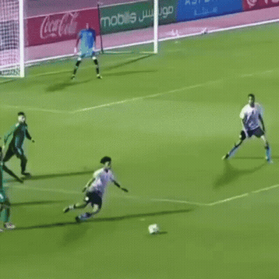 Soccer Players Playing With Coca Cola Ads GIF