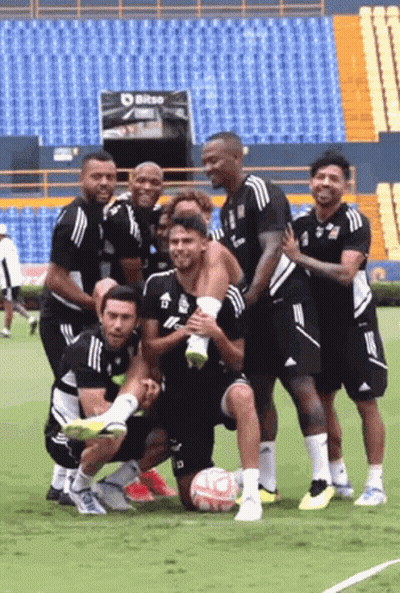 Soccer Players Posing For Photo On Field GIF