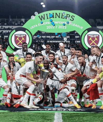 Soccer Players Posing In Front Of Winners Banner GIF