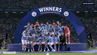 Soccer Players Posing Under Winners Arch GIF