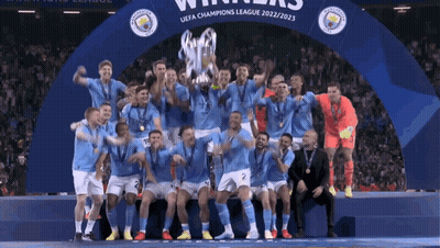 Soccer Players Posing With Champions League Trophy GIF