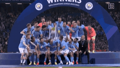 Soccer Players Posing With Champions League Trophy GIF