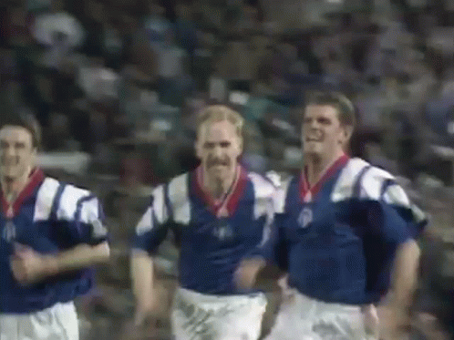 Soccer Players Running In Blue And White Uniforms GIF