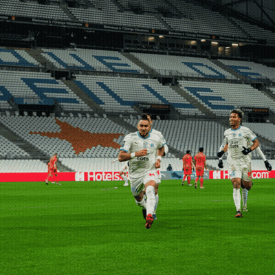 Soccer Players Running On A Field With Uber Eats Written On Their Jerseys GIF
