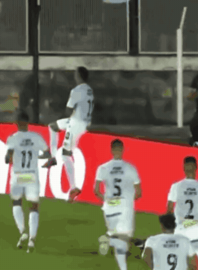 Soccer Players Running On Field Number 9 GIF