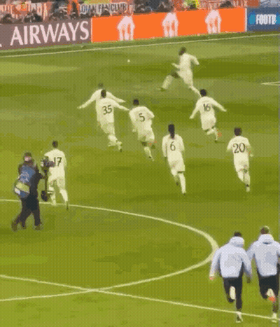 Soccer Players Running With FedEx Ad GIF