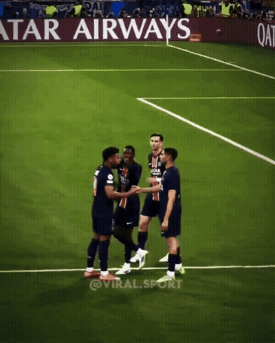 Soccer Players Shaking Hands On A Field With An Advertisement For Qatar Airways In The Background GIF
