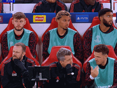 Soccer Players Sitting In Stadium With Walkers And PS5 Logos GIF