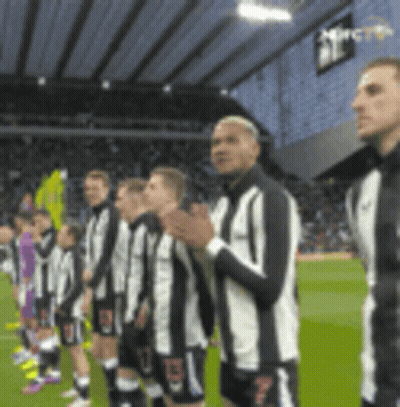 Soccer Players Standing On Field GIF