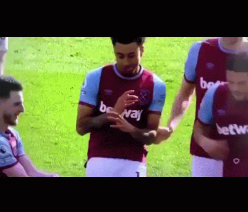 Soccer Players Standing On Field GIF