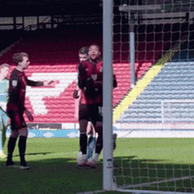 Soccer Players Standing On Field GIF