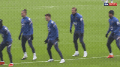 Soccer Players Standing On Field With Sky Sports Logo GIF