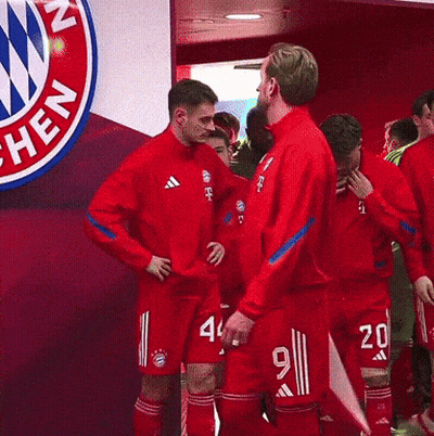 Soccer Players Walking In Front Of T-Mobile GIF
