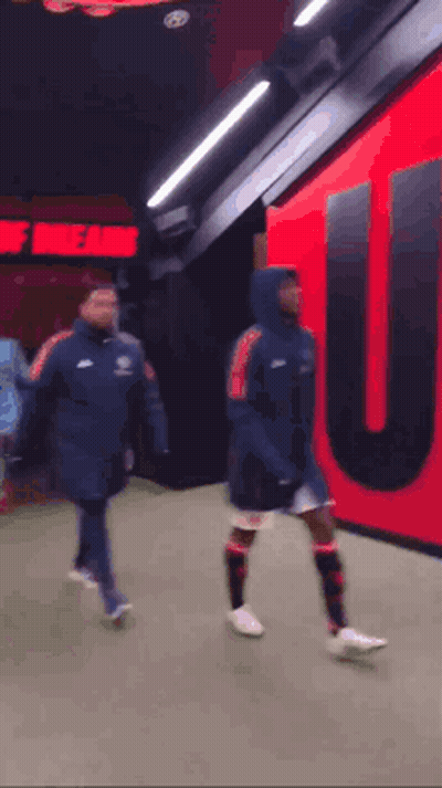Soccer Players Walking Past Theatre Of Dreams GIF